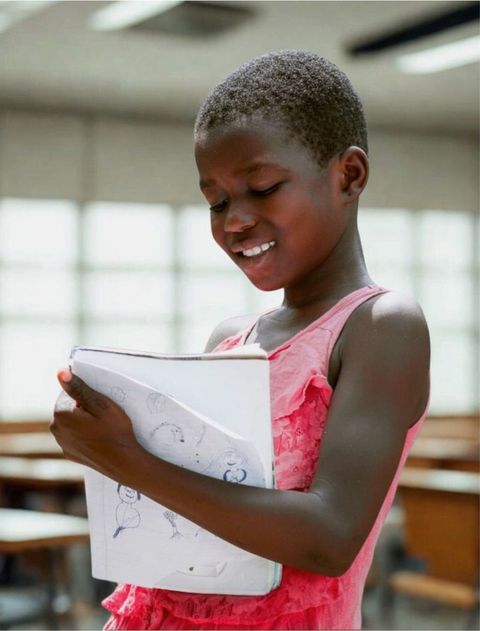 Book-covering-girl-in-classroom Book-covering-girl-in-classroom